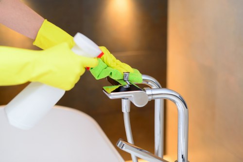 Office cleaning team maintaining kitchen and washroom areas in London