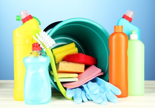 Cleaner working on kitchen and living areas in a London flat
